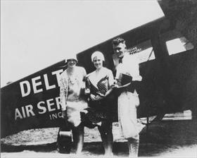 Travel Air with passengers, ca. 1929-1930