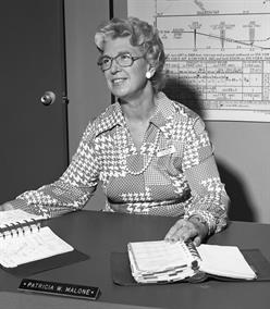 dl_training_instructor_pat_malone_1975_at_desk