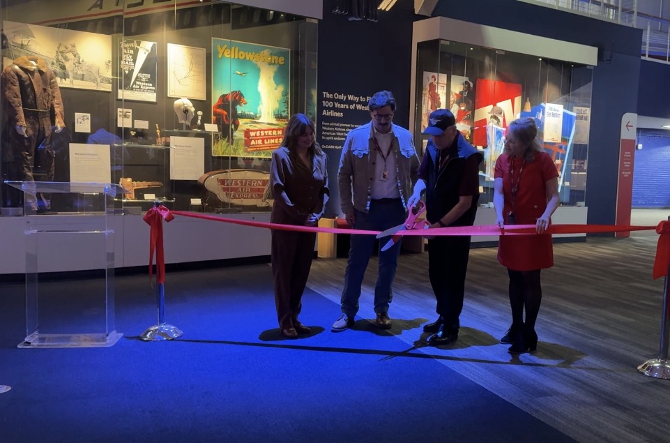 Ribbon cutting with Mike Raftis, former Western employee and current Museum sim operator, doing the honors