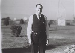 dl_ceo_woolman_standing_with_field_behind_late1920s-1930s